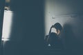 Depressed young woman sitting in a staircase, jobloss due to coronavirus pandemic Royalty Free Stock Photo