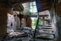 Depressing interior with stairs of an old burned down abandoned house Royalty Free Stock Photo