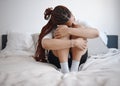 Depression, anxiety and sad woman on bed with a mental healthy problem. Suicide, depressed or insomnia and young girl Royalty Free Stock Photo