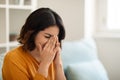 Depression Concept. Portrait Of Young Arab Woman Crying While Sitting At Home Royalty Free Stock Photo