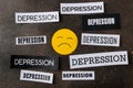 Depression concept. Psychological illness. sad smiley and inscription depression on a dark background. top view