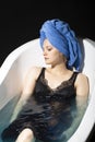 Depression concept. Sad woman in bath. Sadness, fatigue or grief, frustration. Alone upset girl. Royalty Free Stock Photo