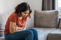 Depression Concept. Sad Young Arab Woman Sitting On Couch At Home Royalty Free Stock Photo