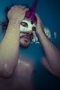 Depression, man in blue tub full of water, sadness concept Royalty Free Stock Photo