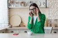 Depression, panic disorders. A young woman is crying at home, wiping her tears with a napkin