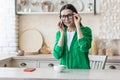 Depression, panic disorders. A young woman is crying at home, wiping her tears with a napkin