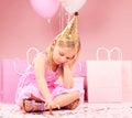 Depression, sad birthday and child on pink background disappointed for party, celebration and event. Lonely, emotion and