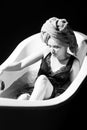 Depression Sad woman in bath. Sadness, grief, frustration. Alone upset girl. Royalty Free Stock Photo