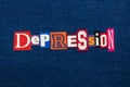 DEPRESSION word text collage, multi colored fabric on blue denim, mental health concept Royalty Free Stock Photo