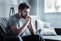 Depressive bearded man being deep in thoughts Royalty Free Stock Photo