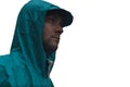 Depressive concept with lonely man in raincoat standing on wet road under rain close up isolated Royalty Free Stock Photo