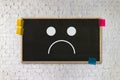 Depressive emotions concept, smiley face emoticon printed depr