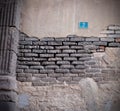 Decayed wall in an old city. Royalty Free Stock Photo