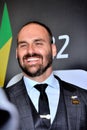 Deputy Eduardo Bolsonaro smiling at the CPAC BRAZIL event