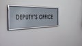 Deputy office door desk closeup, director subordinate, politician, authority