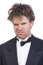 Deranged angry man in a tuxedo