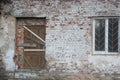 Abandoned house with boarded up windows and decaying crumbling walls Royalty Free Stock Photo