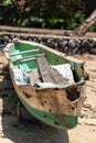 Derelict Balinese canoe on the beach