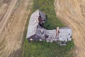 Derelict broken abandoned wooden farm house, aerial