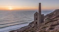 Derelict Cornish tin mine, on the cliff edge, against a blue sky Royalty Free Stock Photo