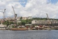 Derelict dockyard by river in city