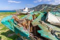 Derelict Fishing Boats out of sea in afternoon light in Pomos harbor