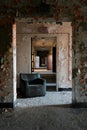 Derelict Hallway with Rubber Chair - Abandoned Central Islip State Hospital - New York