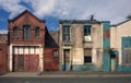 Derelict houses and abandoned garage on a residential street