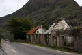 Derelict Houses in Ireland along the main road with trees on the background Royalty Free Stock Photo