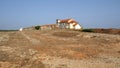 Derelict medieval monastery in a deserted landscape, 15th-century Baroque church of Our Lady of the Cape, Cabo Espichel, Portugal Royalty Free Stock Photo