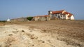 Derelict medieval monastery in a deserted landscape, 15th-century Baroque church of Our Lady of the Cape, Cabo Espichel, Portugal Royalty Free Stock Photo