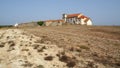 Derelict medieval monastery in a deserted landscape, 15th-century Baroque church of Our Lady of the Cape, Cabo Espichel, Portugal Royalty Free Stock Photo