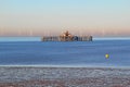 Derelict pier and windfarm