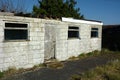 Derelict single story white building Royalty Free Stock Photo