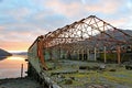 Derelict warehouse at Sunset over Loch Long Royalty Free Stock Photo