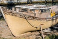 Derelict wood boat in dry dock