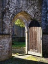 Derlect medieval church with open wooden door Royalty Free Stock Photo