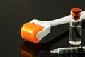 Derma roller for medical micro needling therapy with syringe and vial Royalty Free Stock Photo