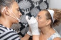 Dermatologist Administering Platelet Rich Plasma PRP Cosmetic Therapy Near A Woman`s Eyes