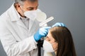 Dermatologist Doctor Checking Woman Hair For Dandruff