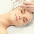 Dermatology skin care facial therapy. Medical spa anto wrinkles procedure. Woman face rejuvenation. Pretty girl. Rf cosmetician Royalty Free Stock Photo