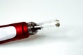Dermis stamp electric pen. Dermapen. Needle mesotherapy treatment. Royalty Free Stock Photo