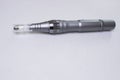 Dermis stamp electric pen. Dermapen. Needle mesotherapy treatment.