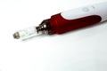 Dermis stamp electric pen. Dermapen. Needle mesotherapy treatment. Royalty Free Stock Photo