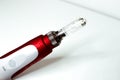 Dermis stamp electric pen. Dermapen. Needle mesotherapy treatment.