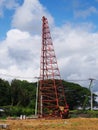 Derrick crane at construction work site Royalty Free Stock Photo