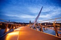 Derry, Ireland. Illuminated Peace bridge in Derry Londonderry, City of Culture, in Northern Ireland with city center at Royalty Free Stock Photo