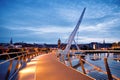 Derry, Ireland. Illuminated Peace bridge in Derry Londonderry, City of Culture, in Northern Ireland with city center at