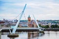 Derry, Ireland. Illuminated Peace bridge in Derry Londonderry, City of Culture, in Northern Ireland with city center at