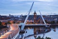 Derry, Ireland. Illuminated Peace bridge in Derry Londonderry, City of Culture, in Northern Ireland with city center at Royalty Free Stock Photo